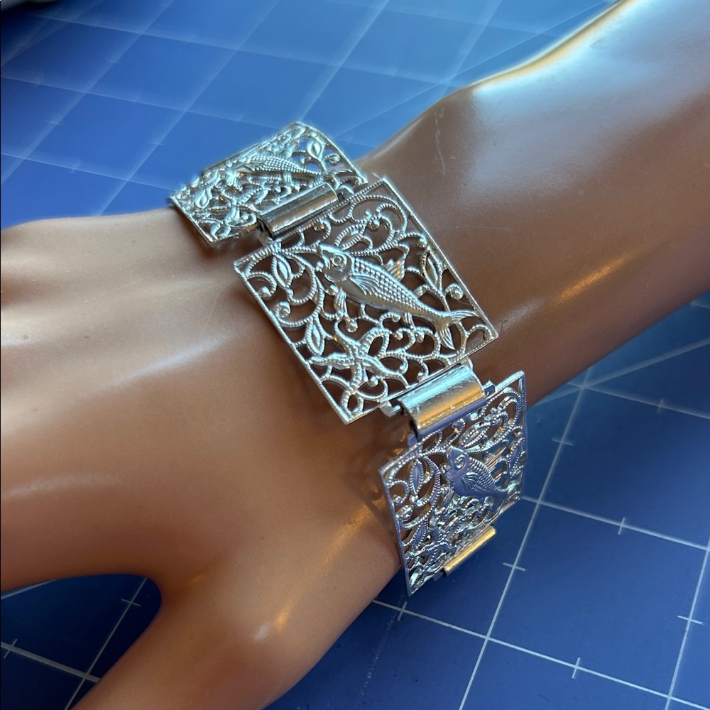 Bracelet fold over clasp 5 open lattice panels fish swim 1950’s West Germany euc